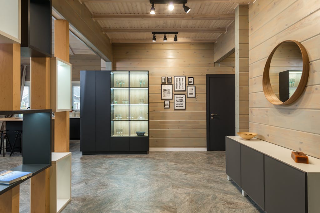 Spacious and elegant modern apartment interior with minimalist design featuring wooden accents and luxury decor.