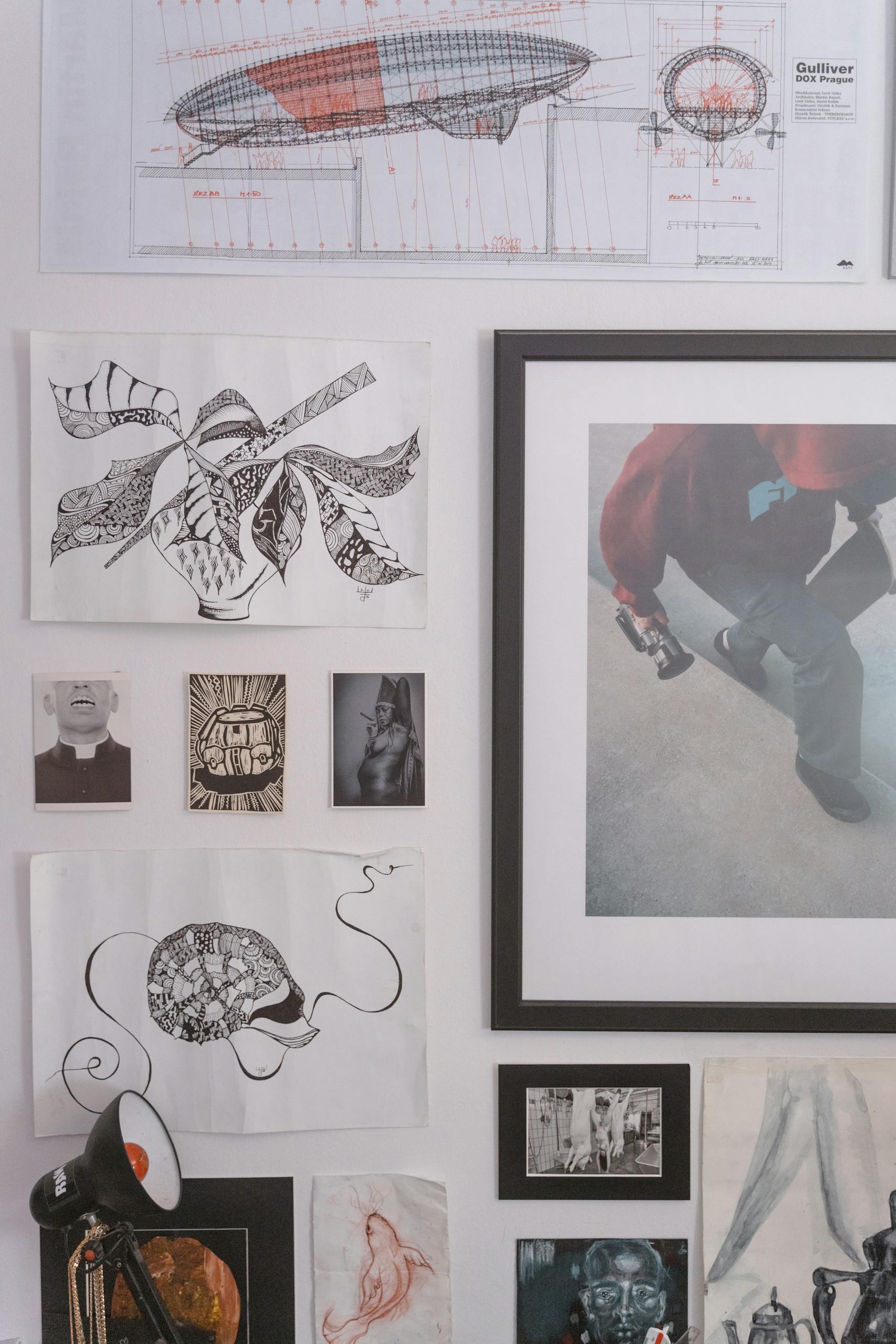 A curated gallery wall displaying diverse artworks in various styles.